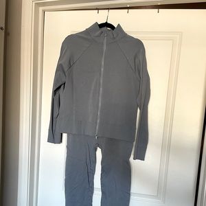 Light blue athletic track suit